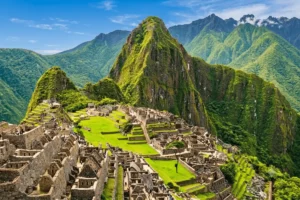 Panoramic view of the ancient Machu Picchu stone ruins and green terraces nestled between steep mountain peaks